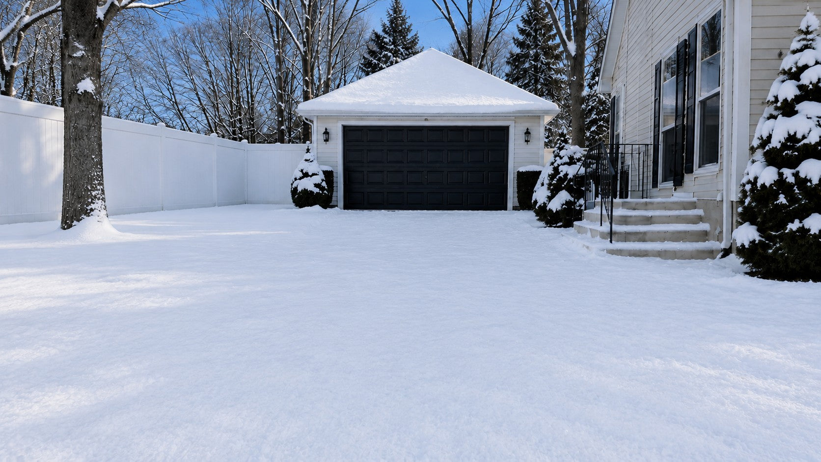 Snow-covered driveway before clearing